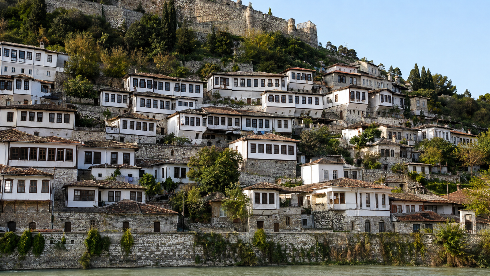 Gjirokastër’s historic stone houses climbing the hillside below the castle