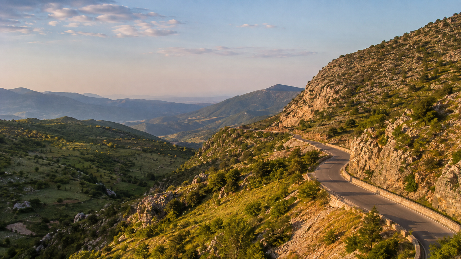 Scenic mountain road winding through Muzinë Pass in southern Albania