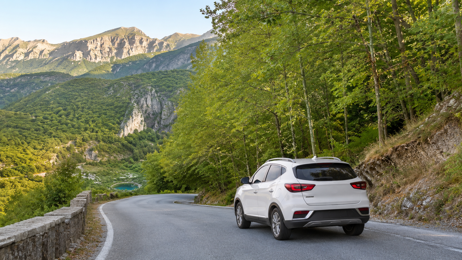 Rental car travelling through the green landscape on the road to the Blue Eye