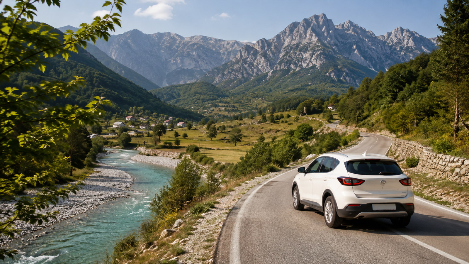 Rental SUV travelling through the mountain landscape toward Lake Koman and Valbona