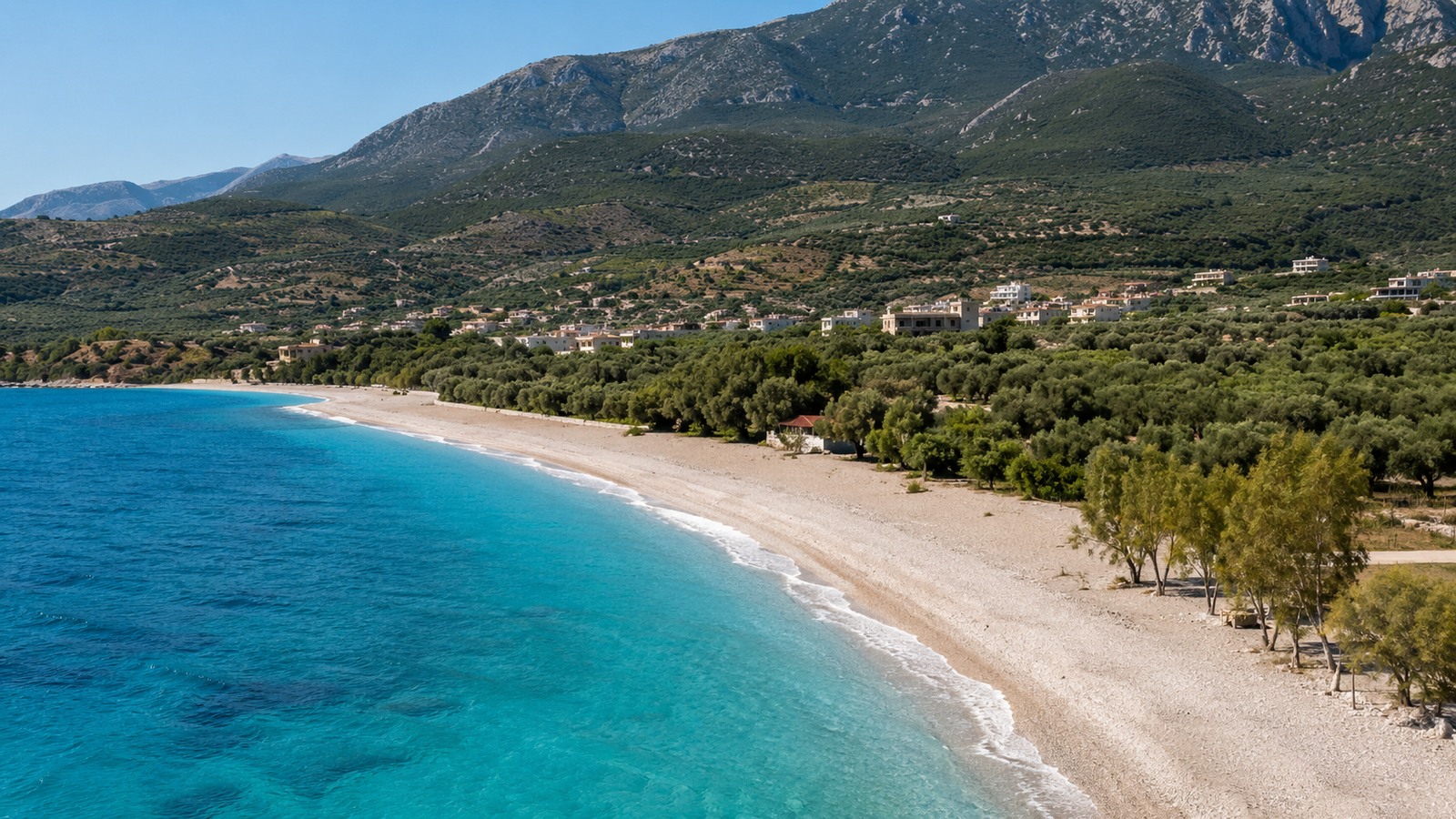 Clear turquoise Ionian water and white pebbles on the Albanian Riviera