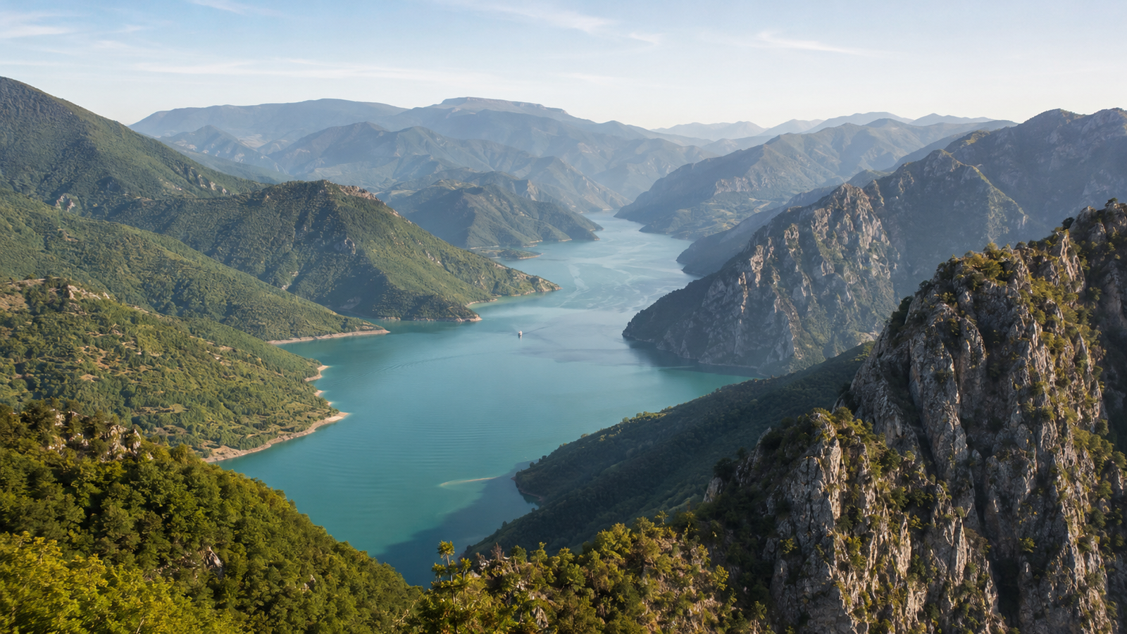 Panoramic view across Valbona Valley and the rugged peaks of the Albanian Alps